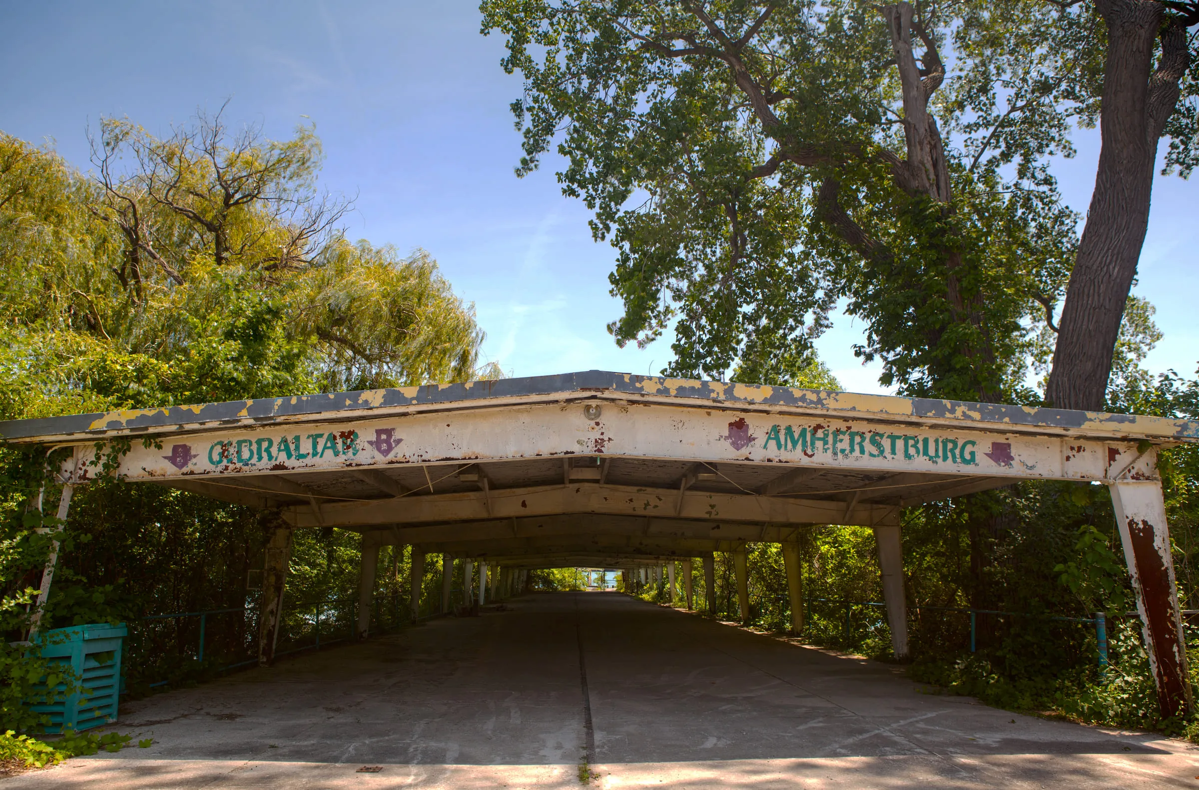 A derelict covered dock shelter with GIBRALTAR and AMHERSTBURG painted on its fascia