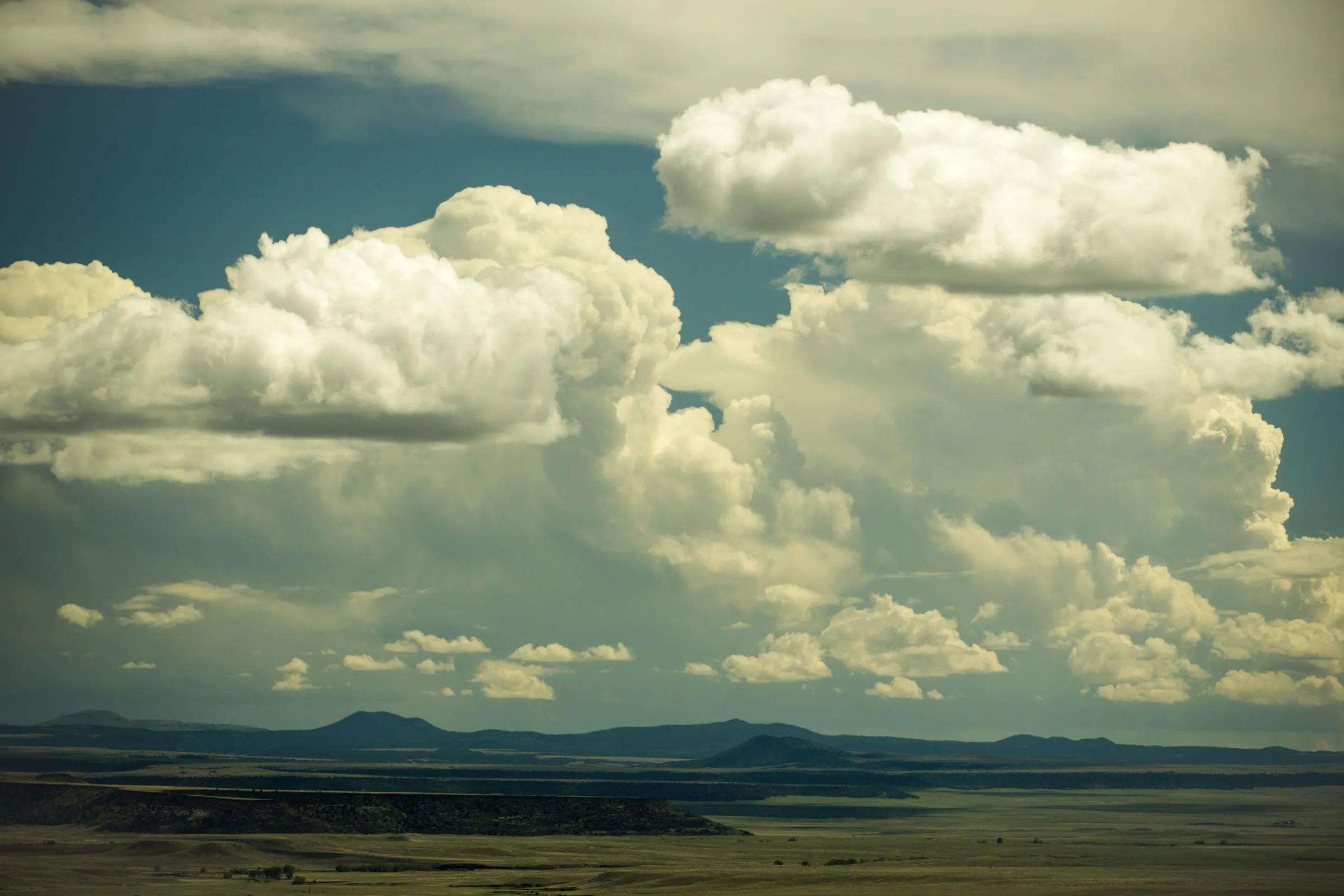 Towering cumulus clouds over the flat-topped mesas and open grassland outside Trinidad, Colorado